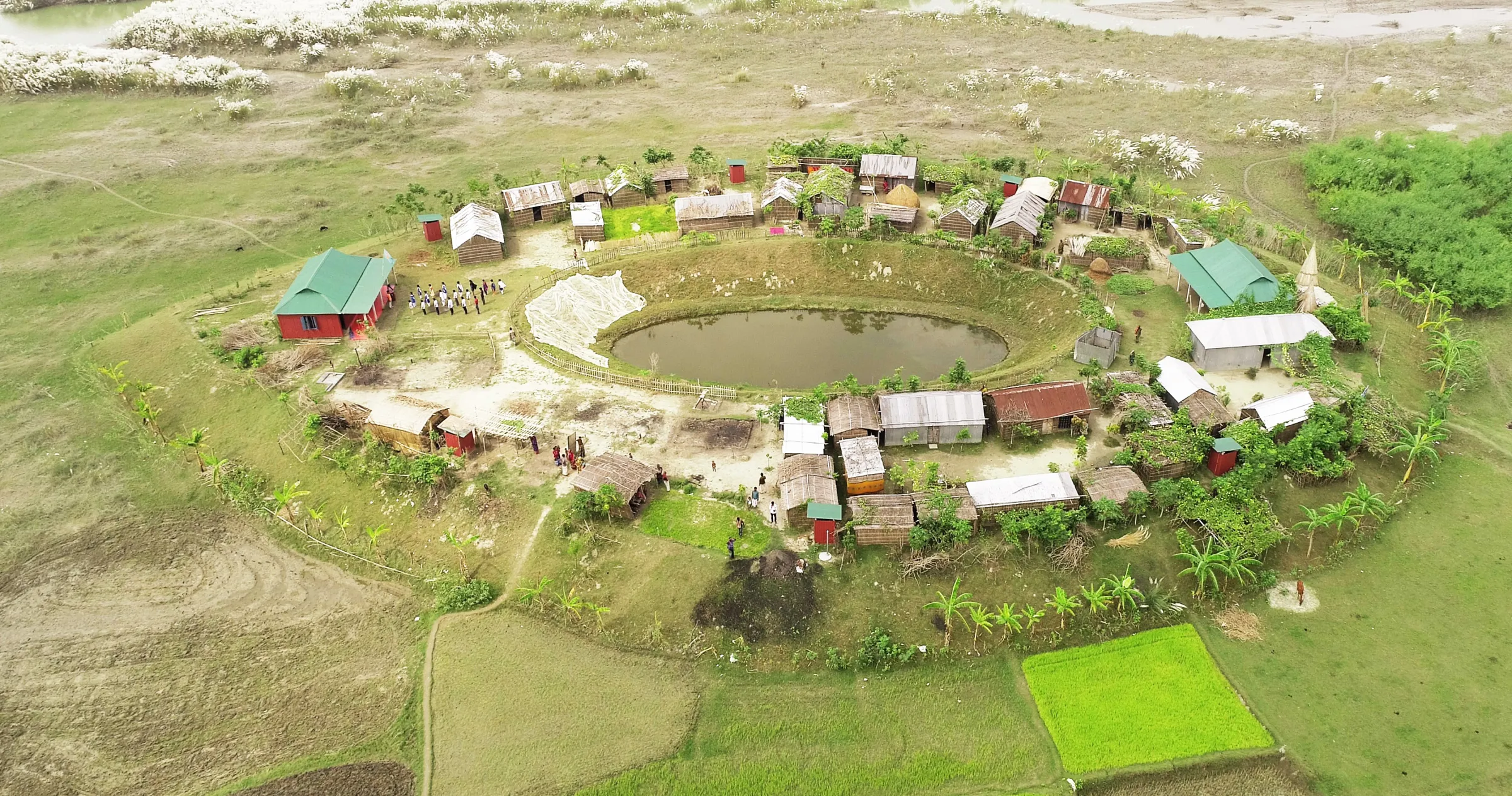 A plinth is a raised platform designed to protect flood-prone communities. Developed with researchers and architects, its egg-shaped, north-facing design diverts floodwaters and so reduces the risk of flooding. Built over 3.5 meters above flood level, plinths remain dry even during severe floods