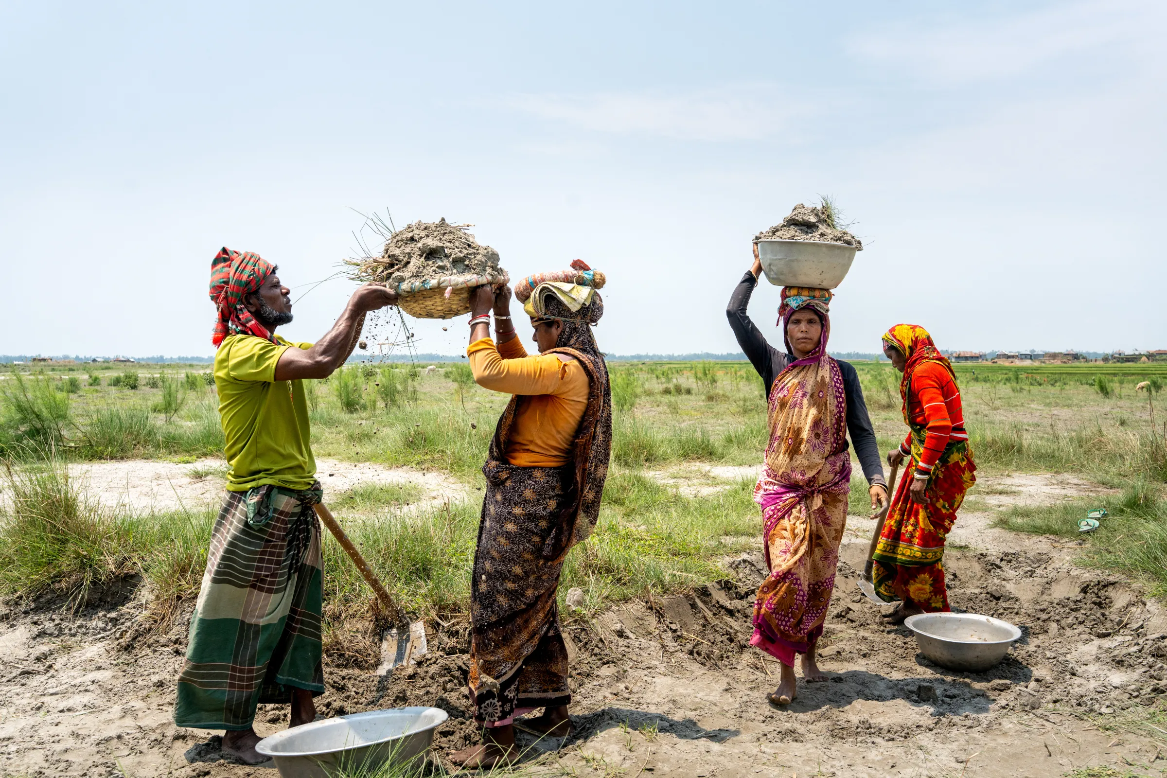Four women working the plinth land in Bangladesh