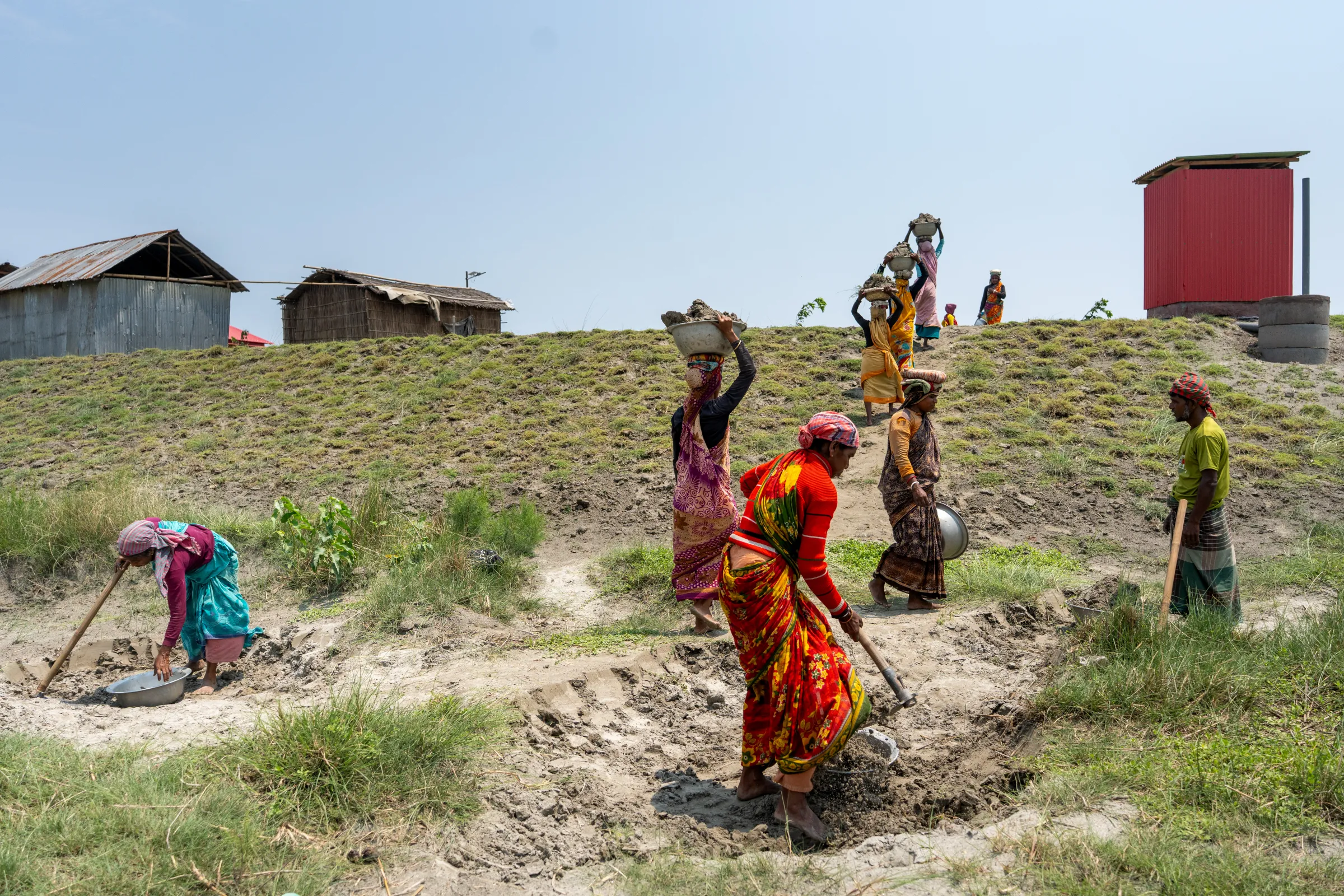 A group of Bangladeshi women working on the plinth land