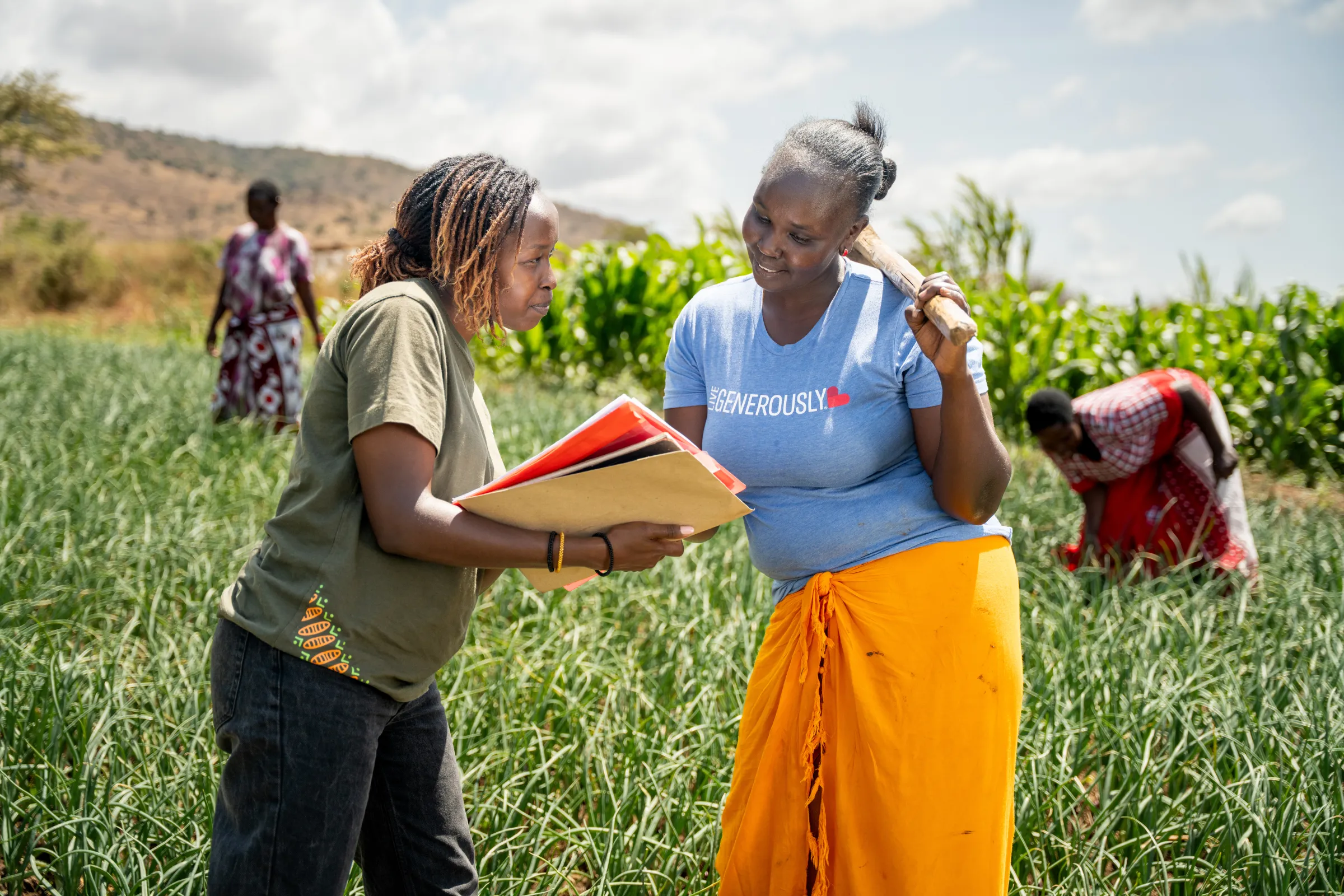 Women farmers in Kenya consulting the best approach