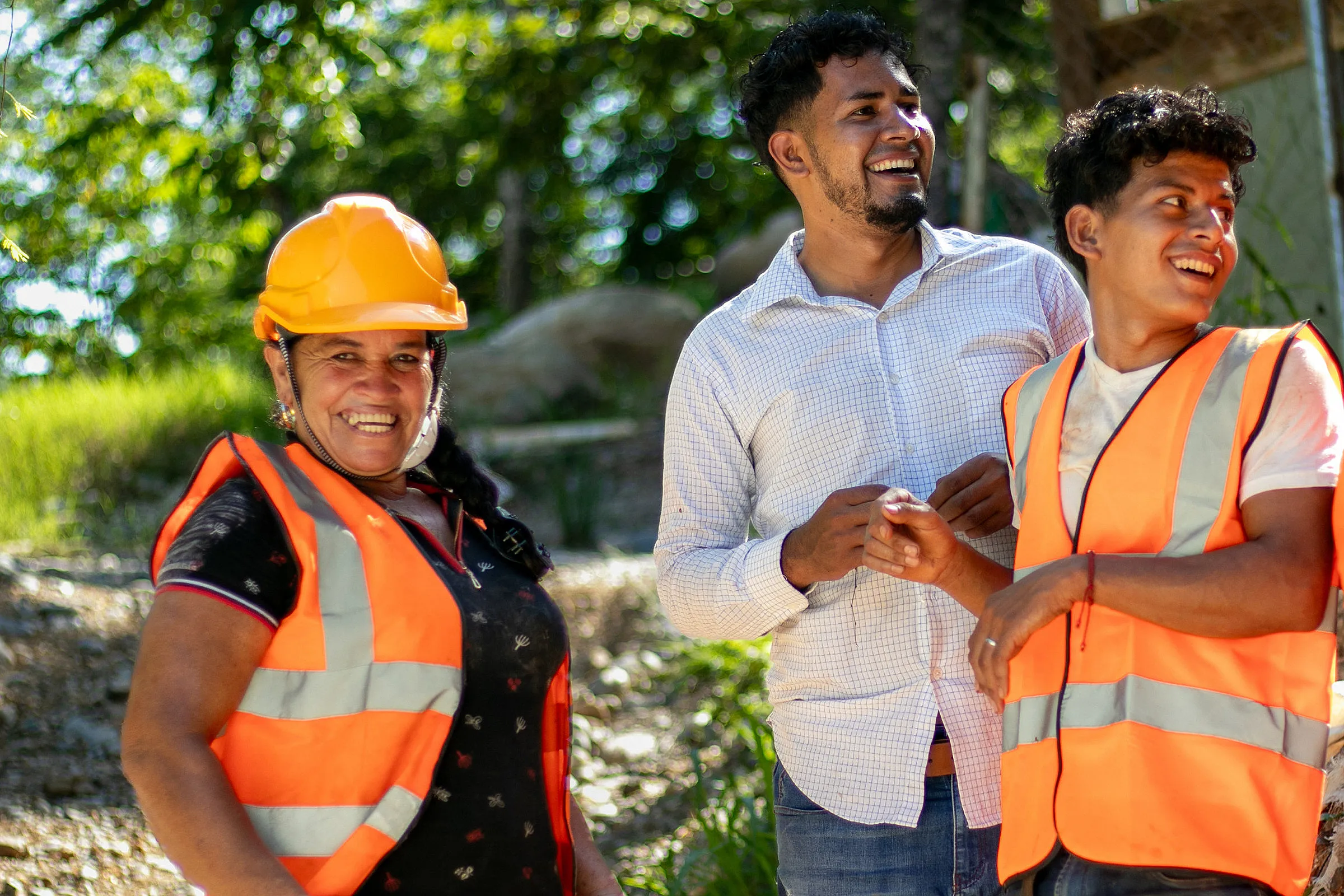 Group of laughing mine workers in labour attire