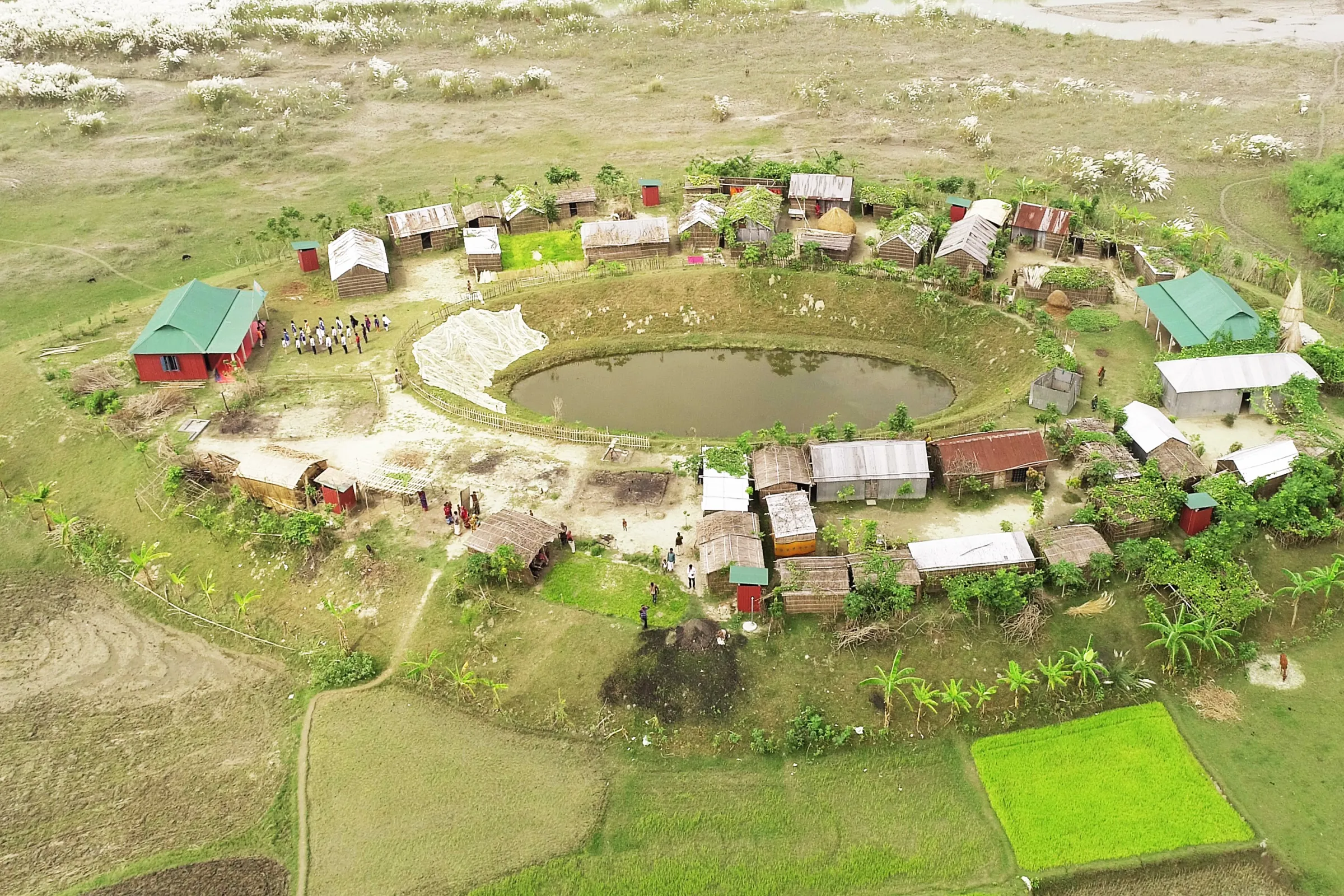 A plinth is a raised platform designed to protect flood-prone communities. Developed with researchers and architects, its egg-shaped, north-facing design diverts floodwaters and so reduces the risk of flooding. Built over 3.5 meters above flood level, plinths remain dry even during severe floods