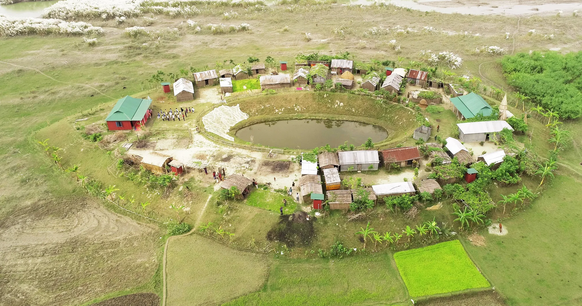 A plinth is a raised platform designed to protect flood-prone communities. Developed with researchers and architects, its egg-shaped, north-facing design diverts floodwaters and so reduces the risk of flooding. Built over 3.5 meters above flood level, plinths remain dry even during severe floods