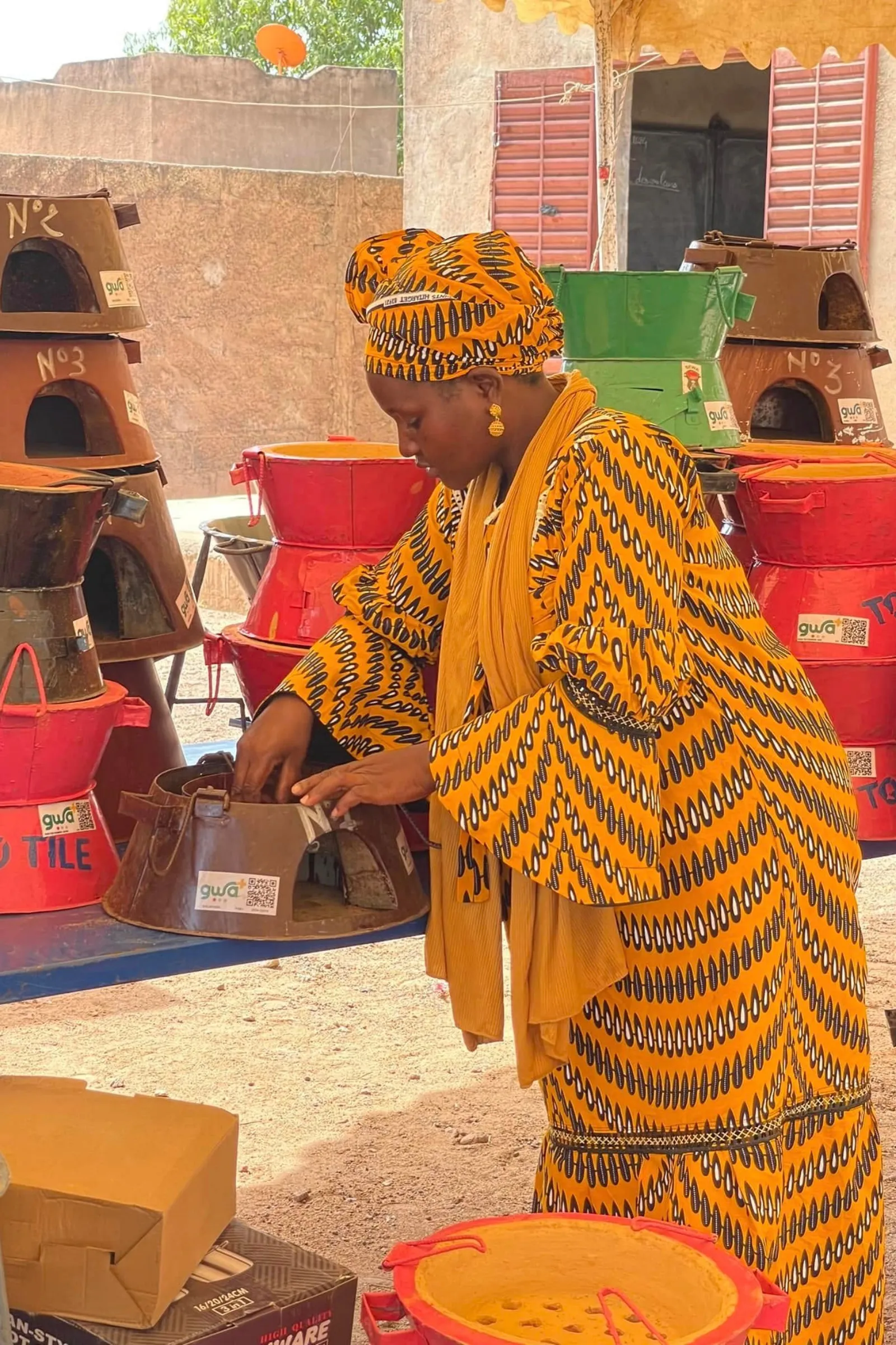 African woman sorting clean cooking devices